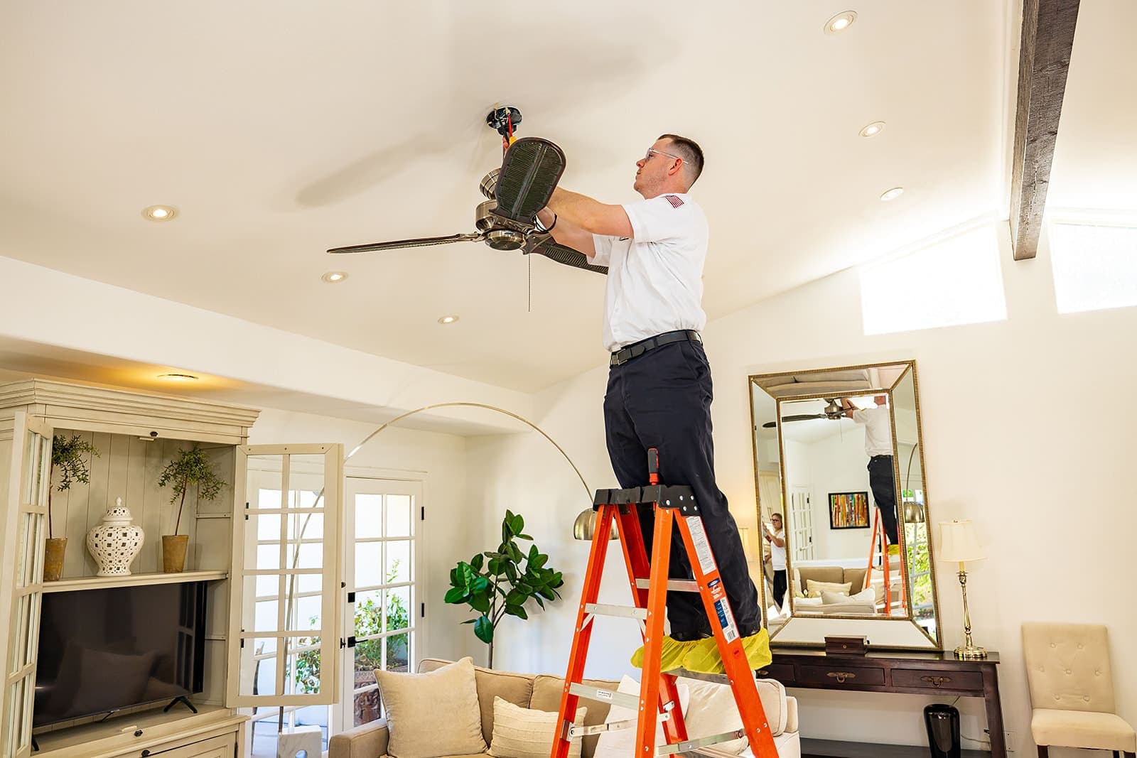Home Team Electric electrician inspecting an electrical panel in a desert home, Coachella Valley California