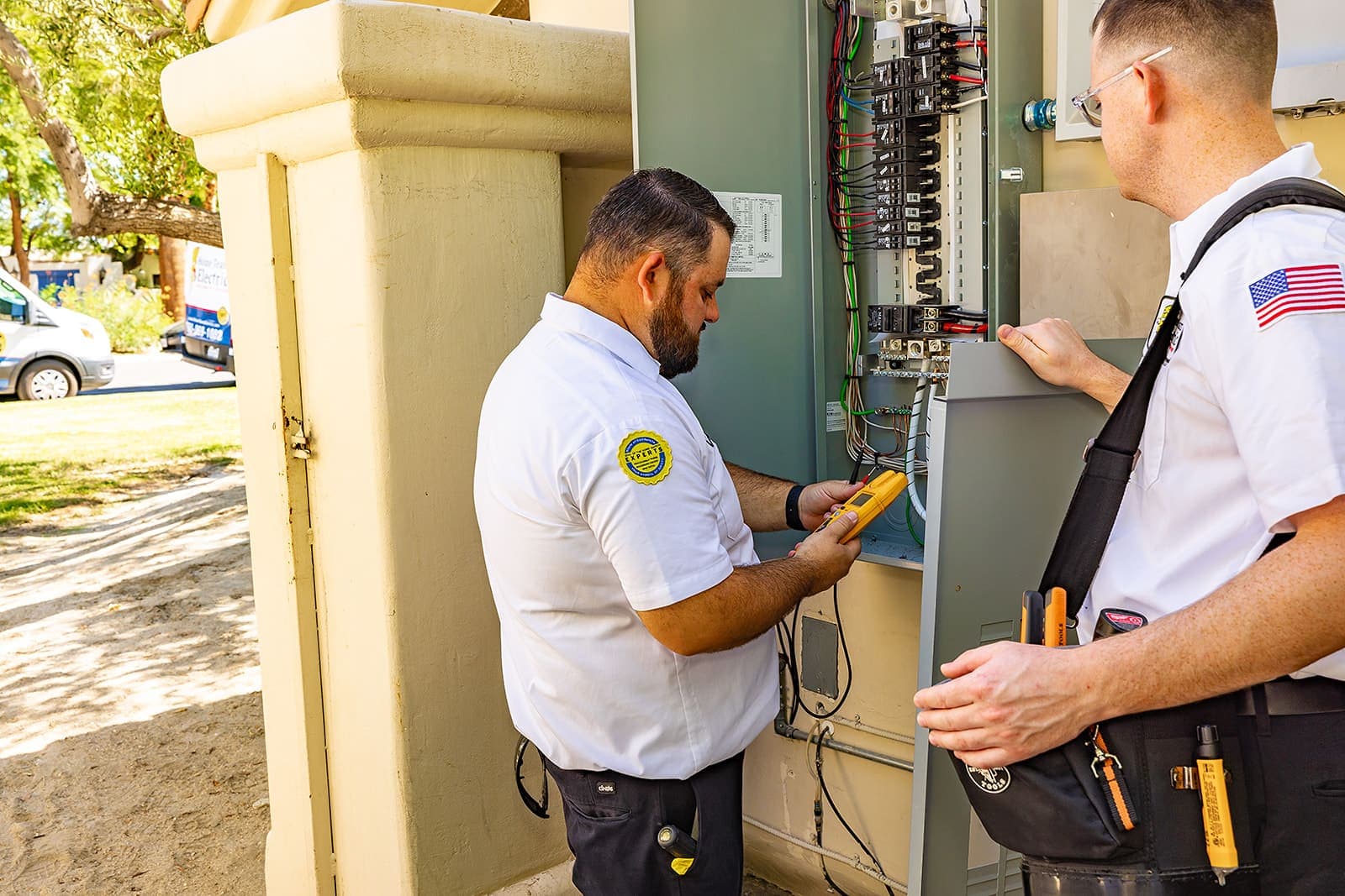 Home Team Electric electrician inspecting an electrical panel in a desert home, Coachella Valley California