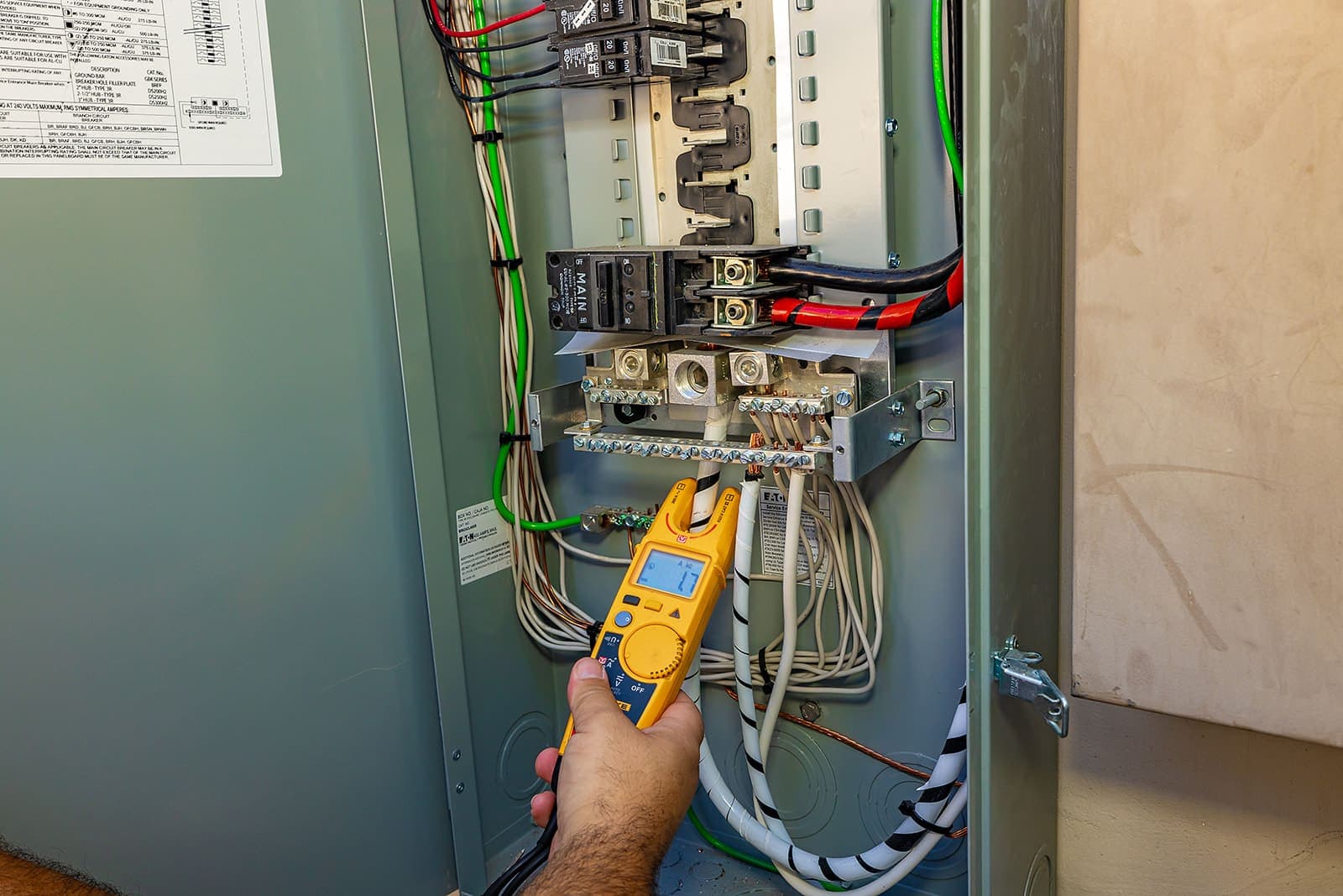 A Home Team Electric electrician diagnosing a circuit in a Coachella Valley home
