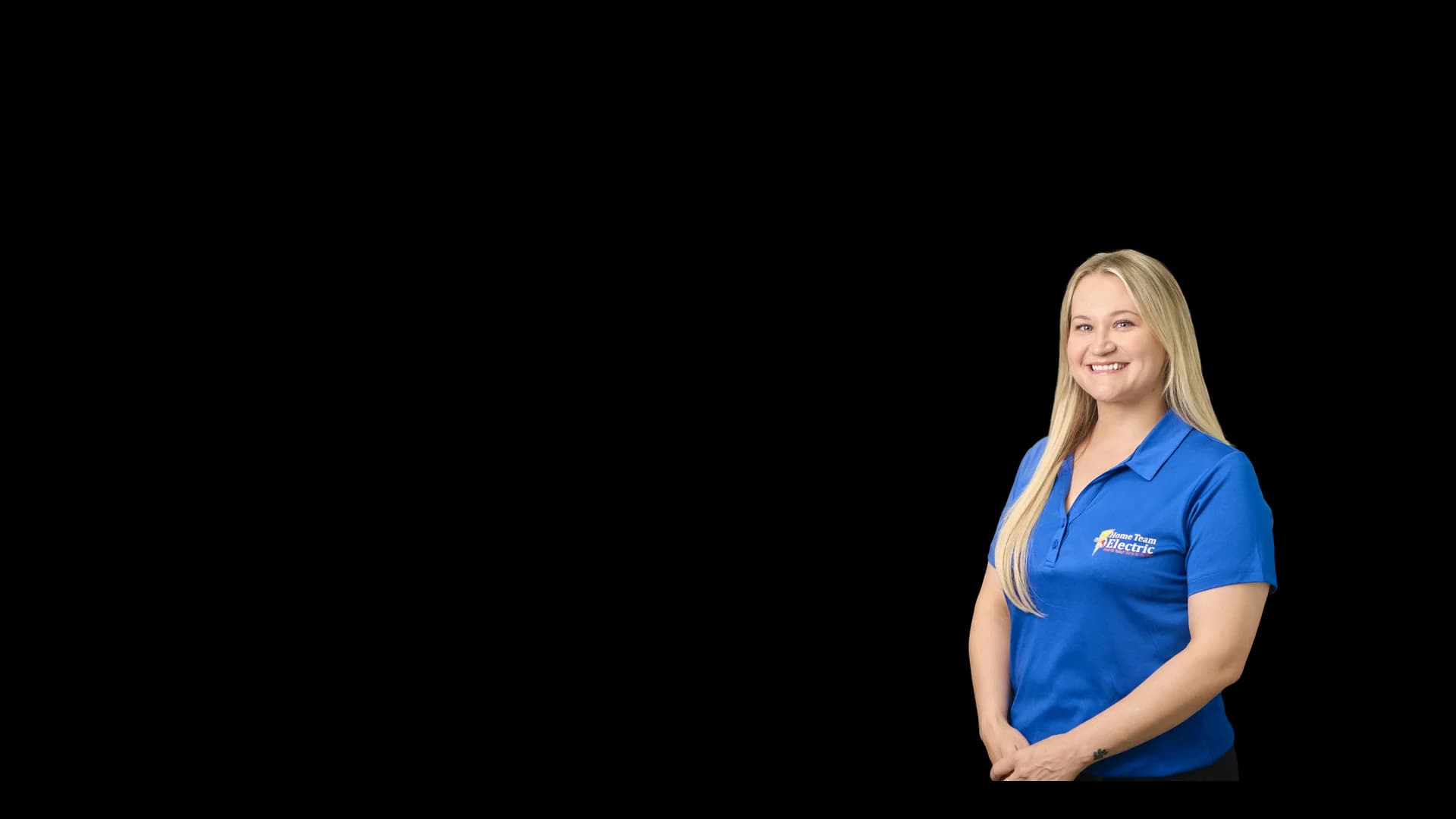 Shannon Anderson, smiling Home Team Electric team member in a branded polo