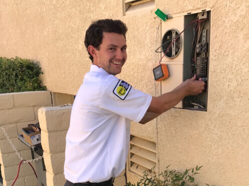 Electrician working on an electrical panel in Palm Springs, CA